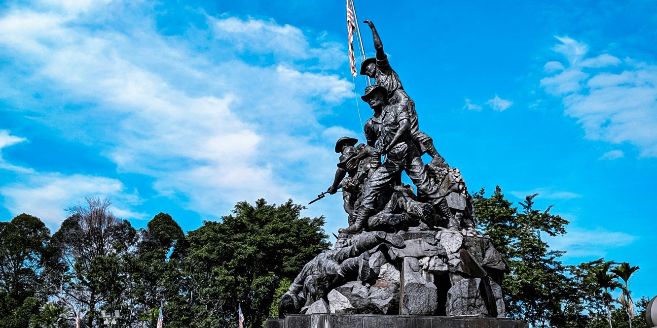 Monument depicting soldiers raising the Malaysian flag in Kuala Lumpur